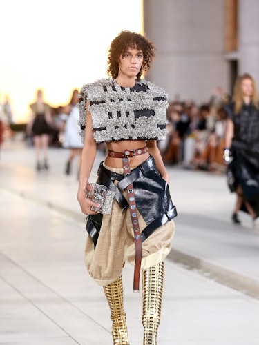 A model walks the runway of the Louis Vuitton cruise 2023 show