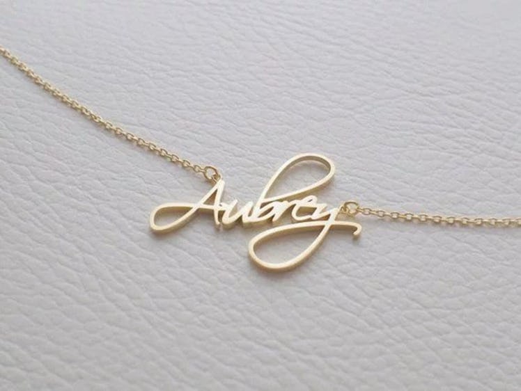 A personalized name necklace is one of the sentimental graduation gifts for best friends.