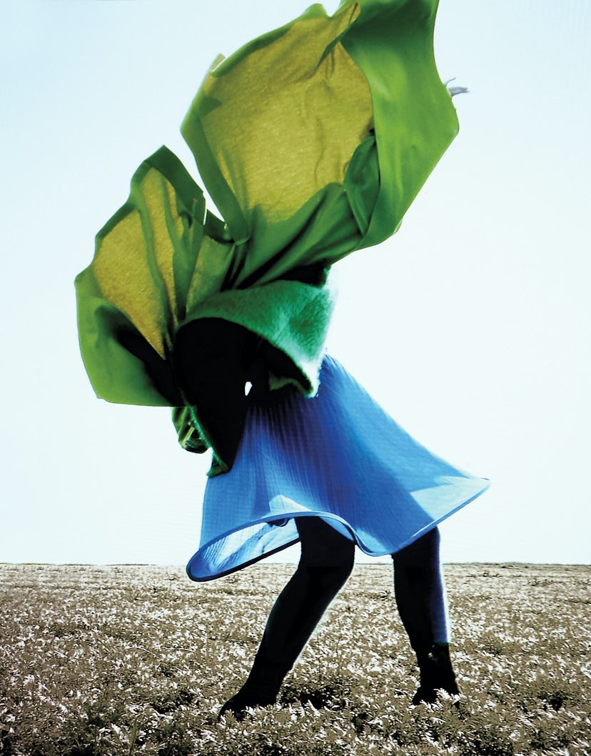 Grace Lyell wears an Issey Miyake coat; Salvatore Ferragamo cardigan; Terrence Zhou skirt; Kenzo leg...