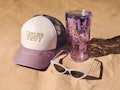 Taylor Swift's Swiftie summer Collection items include tumblers, AirPods cases, and portable charger...