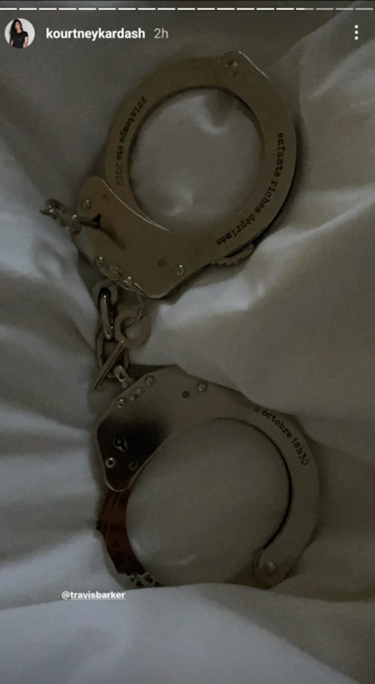 Kourtney Kardashian posted handcuffs engraved with her potential wedding date. 