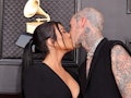 Kourtney Kardashian and Travis Barker kissing in Las Vegas before their courthouse wedding, where sh...