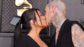 Kourtney Kardashian and Travis Barker kissing in Las Vegas before their courthouse wedding, where sh...