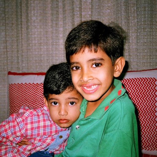 '90s photo of Indian brothers with arm around each other ; intagram captiosn for national brothers d...