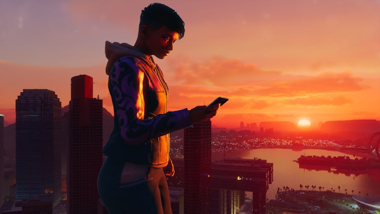 Player uses smartphone as the sun sets