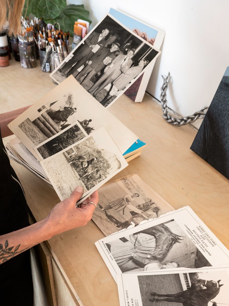 Sarah Miska looking at photos of horses