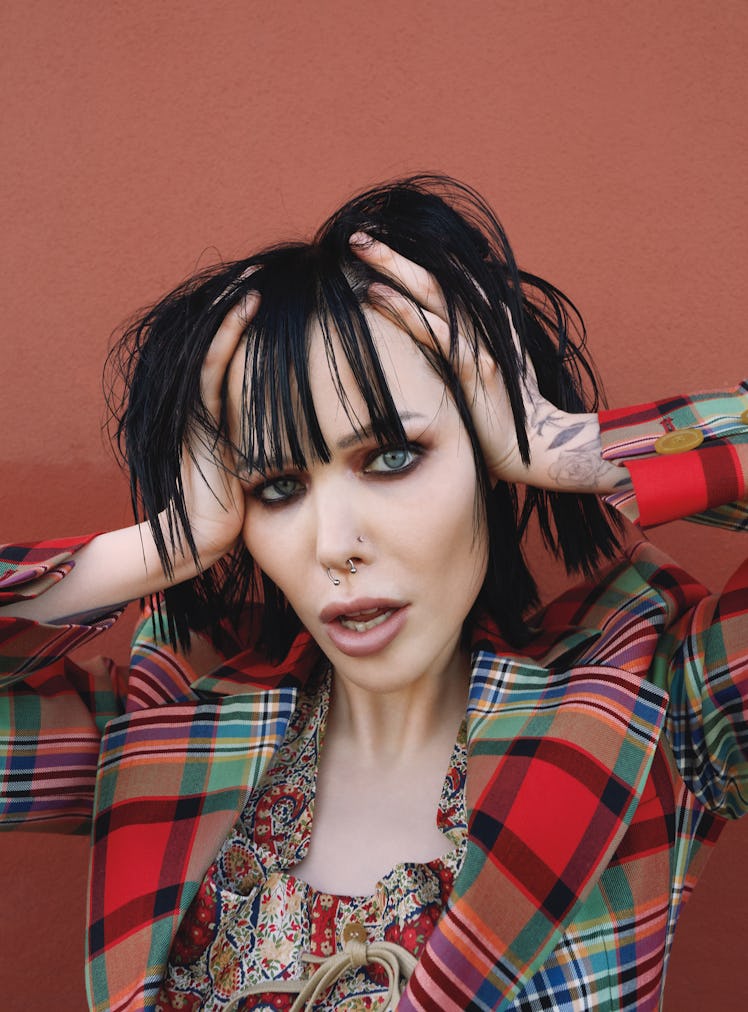 Alice Glass wears a Vivienne Westwood jacket and top; her own jewelry.