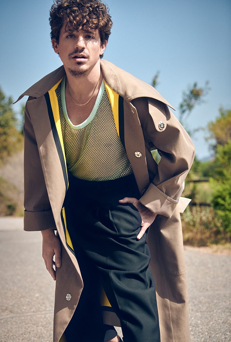 Charlie Puth in a waistcoat, mesh shirt and black pants all by AMI Paris