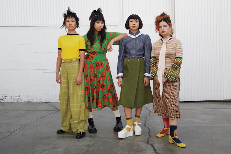 The Linda Lindas, from left: Eloise Wong wears a Cormio T-shirt; Collina Strada pants and belt; Roge...