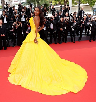 Jasmine Tookes wearing a giant yellow gown at Cannes
