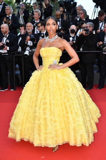 Lori Harvey wearing a yellow gown at Cannes