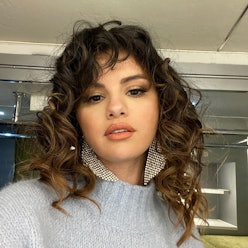 Selena Gomez's Messy Updo Is A Casual Complement To Her Prim Skirt-Suit