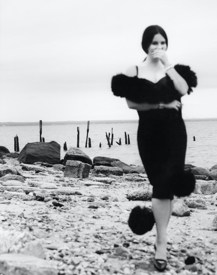 Lana del Rey in blur wearing a Dolce & Gabbana dress, Gucci scarf. Swarovski cuffs and Chanel Haute ...