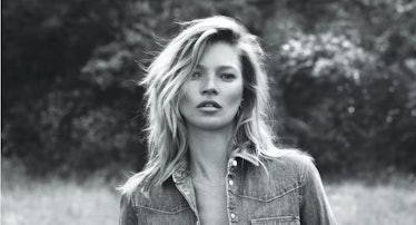 Kate Moss wearing a denim shirt and fishnet tights