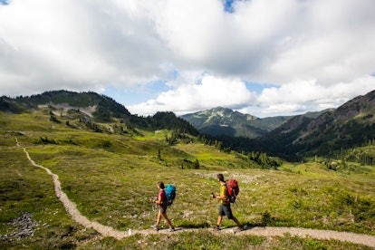 Washington State as the epic family adventure vacation - a couple having backpacking adventure hikin...