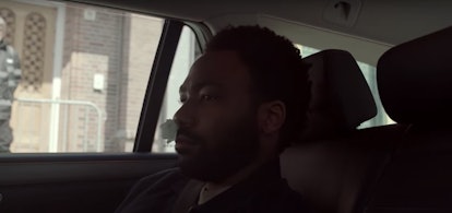 Donald Glover as Earn, with a bloody nose in the backseat of a car on 'Atlanta'