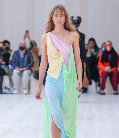 Model wearing a draped dress during Loewe's Spring/Summer 2022 show.