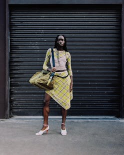 Model carrying diesel's best weekender bag.