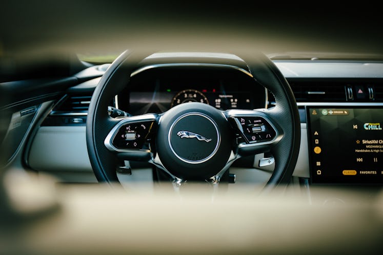 The interior design of Jaguar XF with huge center, side displays, and luxury soft leather 