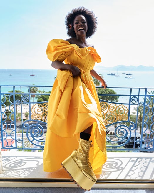 Viola Davis wears Tod's gold platform boots in Cannes.