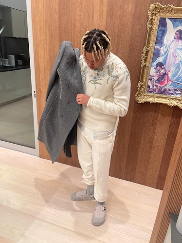 Cordae getting ready for the Dior Men's show