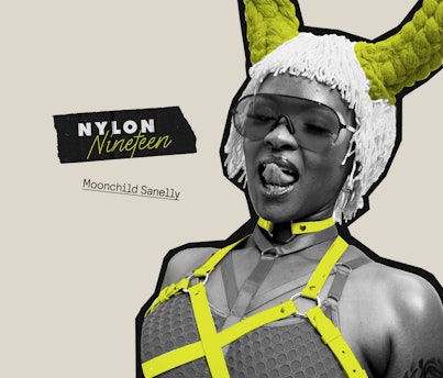 Moonchild Sanelly with yellow straps  around her top, yellow horns and white hair.