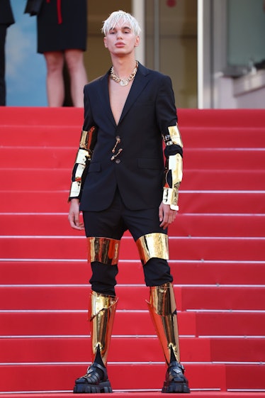 Raduc Bakic wearing a gold metal look at the Cannes Film Festival