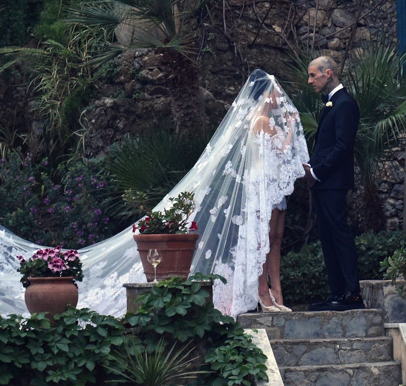 Kourtney Kardashian and Travis Barker’s Italian wedding body language was intense.