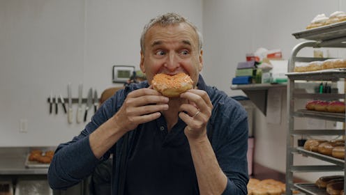 A photo of Phil Rosenthal in 'Somebody Feed Phil' Season 5, preparing for more food in Season 6.