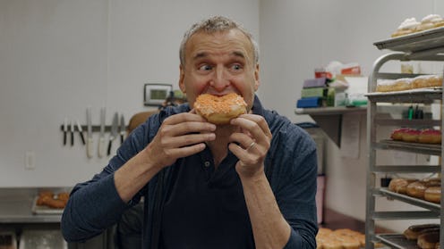 A photo of Phil Rosenthal in 'Somebody Feed Phil' Season 5, preparing for more food in Season 6.