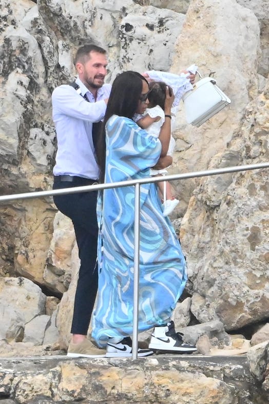 Naomi Campbell holding her daughter in Cannes