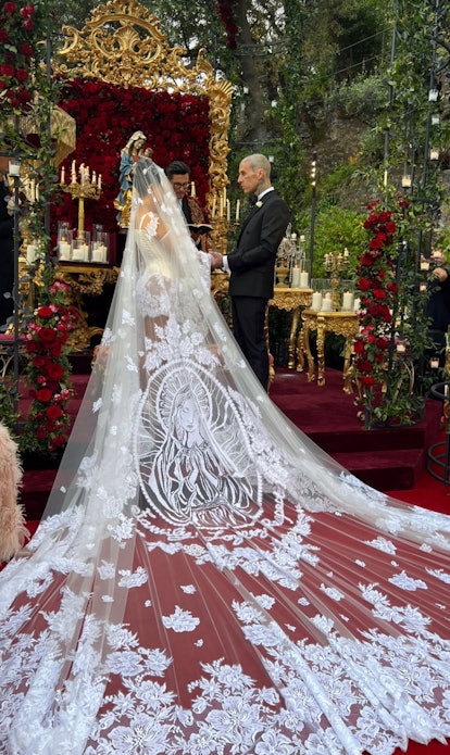 Kourtney Kardashian wears a Dolce & Gabbana wedding dress with a secret meaning for her wedding to T...