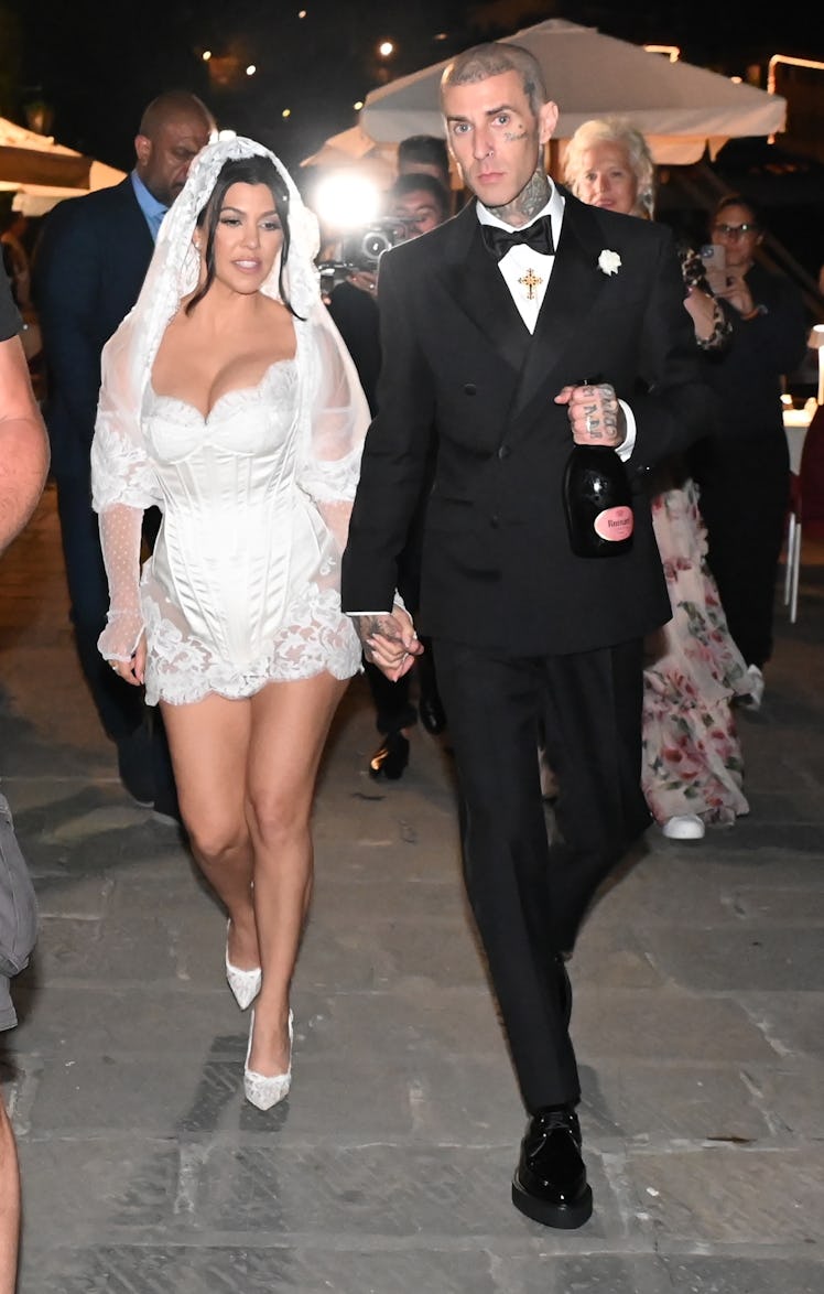 Travis Barker took off Kourtney Kardashian's garter with his teeth.