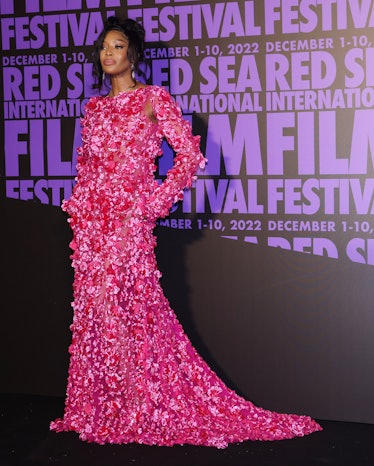 Naomi Campbell wearing a hot pink gown by Valentino