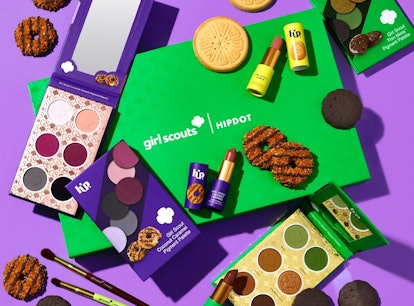 A spread of HipDot's Girl Scout makeup collection including the Thin Mint palette, Coconut Caramel P...