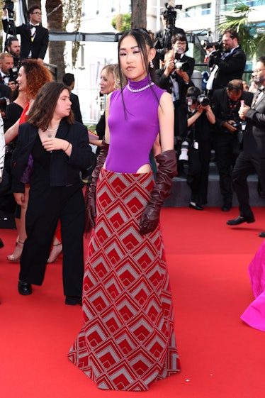 Jamie Xie wearing a red and purple dress at the Cannes Film Festival