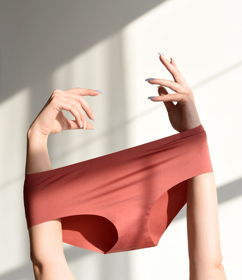 arms holding up underwear , why is my vaginal area dark