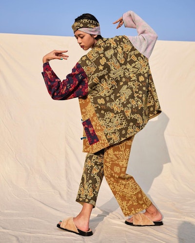 A model posing in yan yan knits, a chinese fashion brand