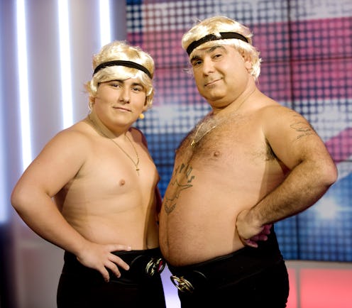Lagi and Demi Flatley pose with bare chests and blond wigs on Britain's Got Talent