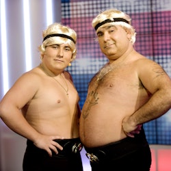 Lagi and Demi Flatley pose with bare chests and blond wigs on Britain's Got Talent