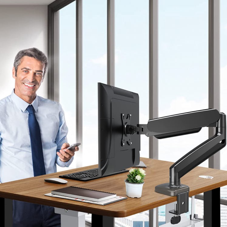 This monitor mount for standing desks features adjustable height and angles. 