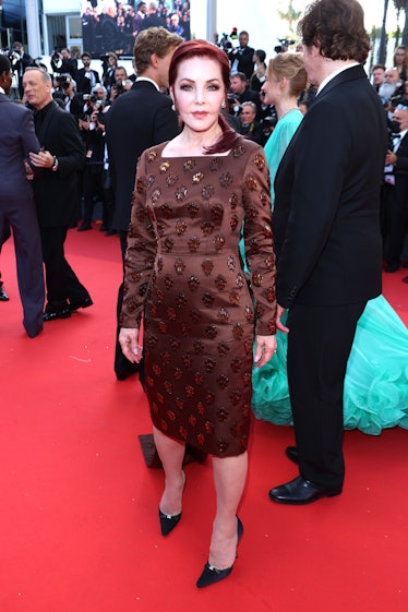Priscilla Presley wearing a dark burgundy dress at the Cannes Film Festival