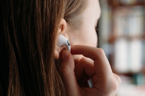A person placing an AirPod Pro into their ear - Best AirPods Pro Ear Tips