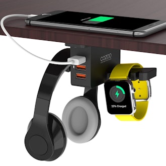 This headphone stand for your standing desk includes three USB charging ports.