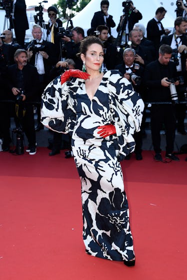 Noomi Rapace wearing red gloves at the Cannes Film Festival