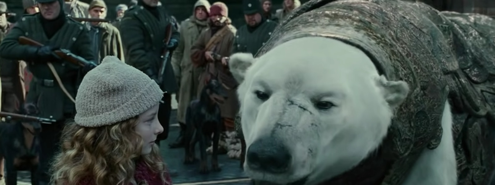 Lyra stands next to her polar bear in The Golden Compass, coming to Netflix in June 2022.