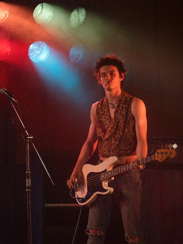 Louis Partridge as Sid Vicious playing the bass in 'Pistol'