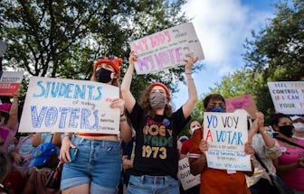 Demonstrators rally against anti-abortion and voter suppression laws at the Texas State Capitol on O...