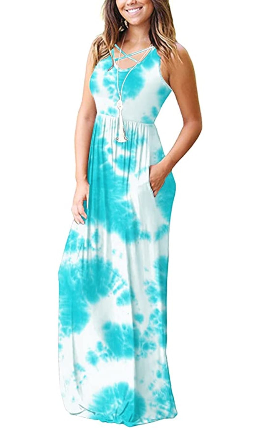A racerback, criss-cross straps in front, and pockets make this maxi dress interesting and stylish.