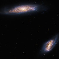 Double trouble: Hubble telescope spies galaxy pair flaunting their sprawling arms